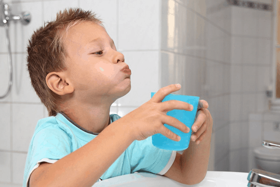 Kid Using Mouthwash