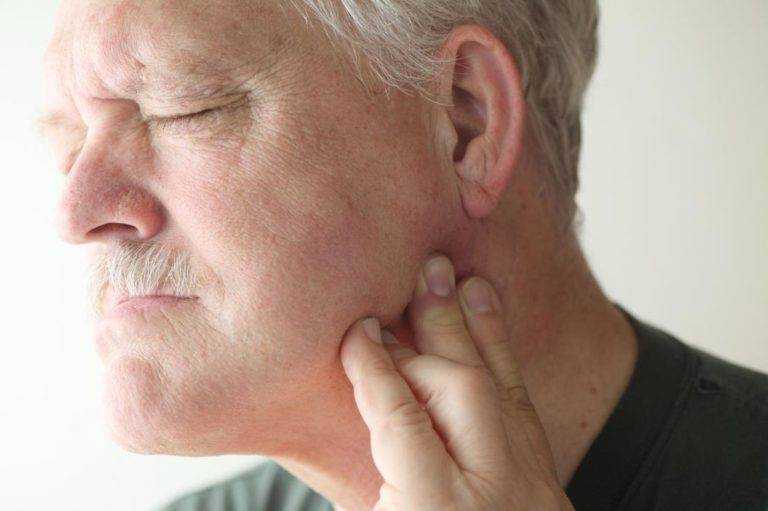 man-with-painful-temporomandibular-joint