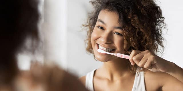Clean food and beverage particles from your teeth by brushing them.