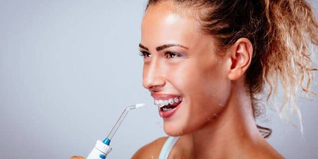 Brush Your Teeth and Braces Using an Oral Irrigator